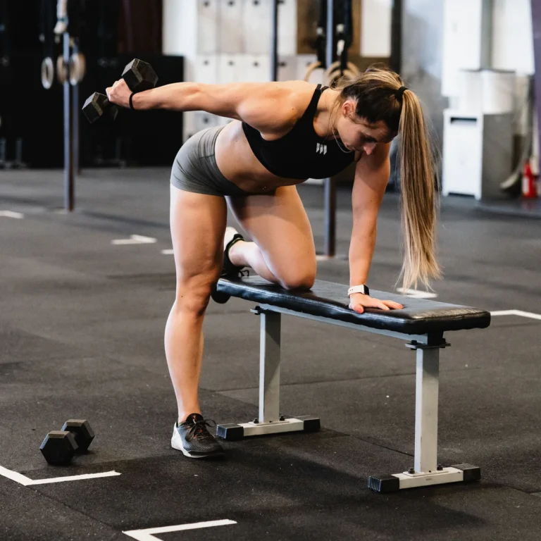 Women doing dumbbell kickbacks